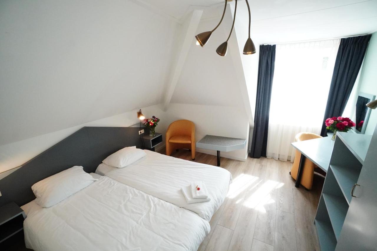 Hotel Den Burg Esterno foto